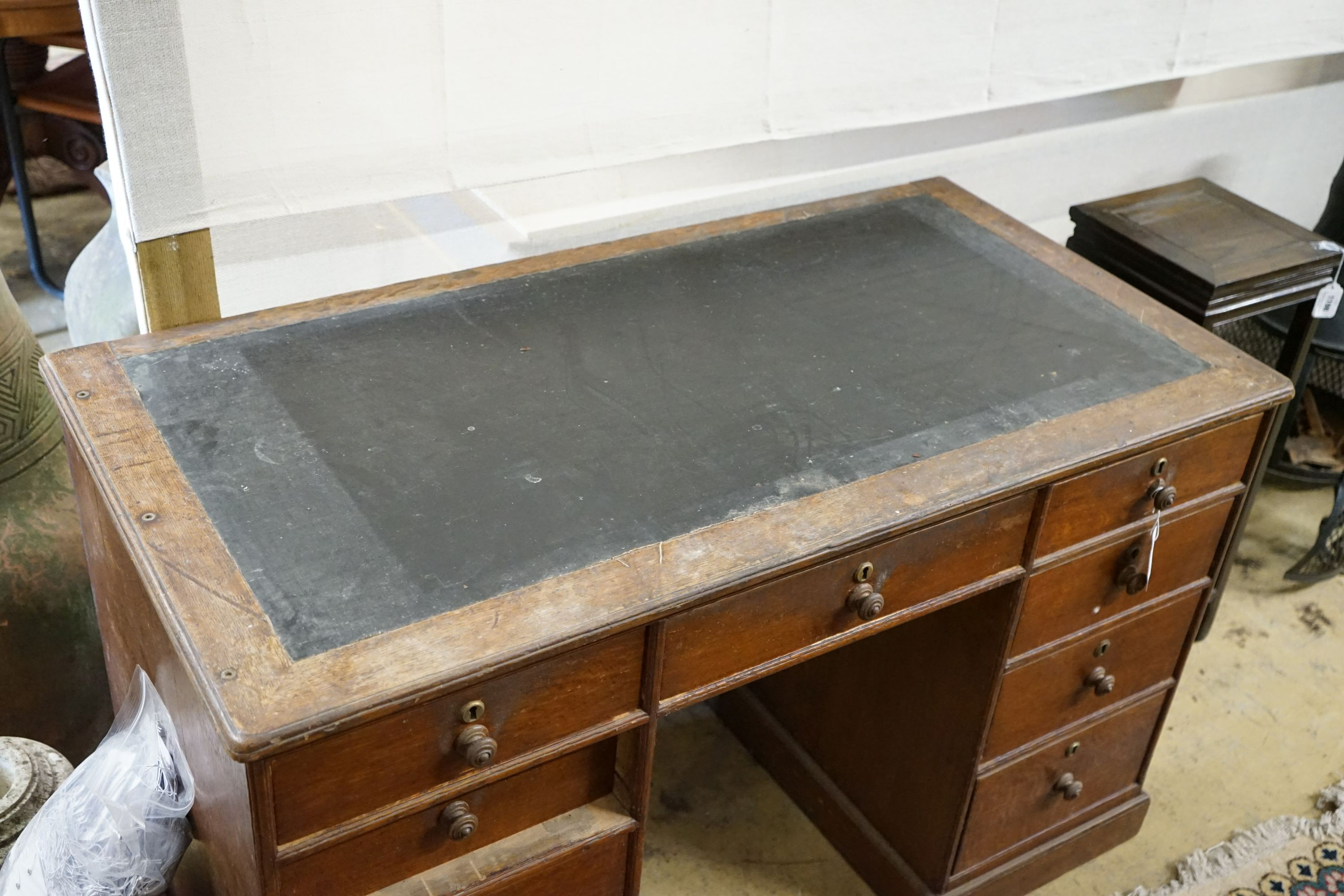 A mid 19th century oak kneehole desk, length 124cm, depth 63cm, height 78cm